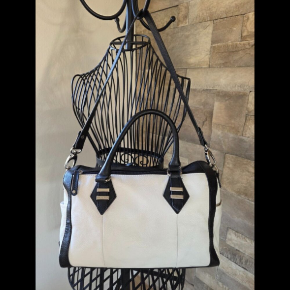 Tignanello Black and White purse with lots of pockets.